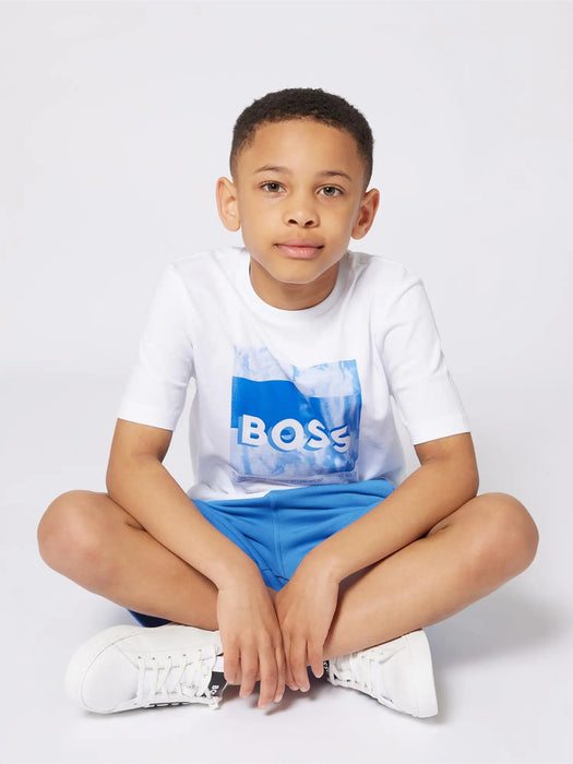 Boy wearing the BOSS graphic t-shirt.