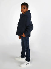 Boy wearing the BOSS jeans.