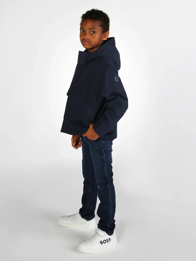 Boy wearing the BOSS jeans.