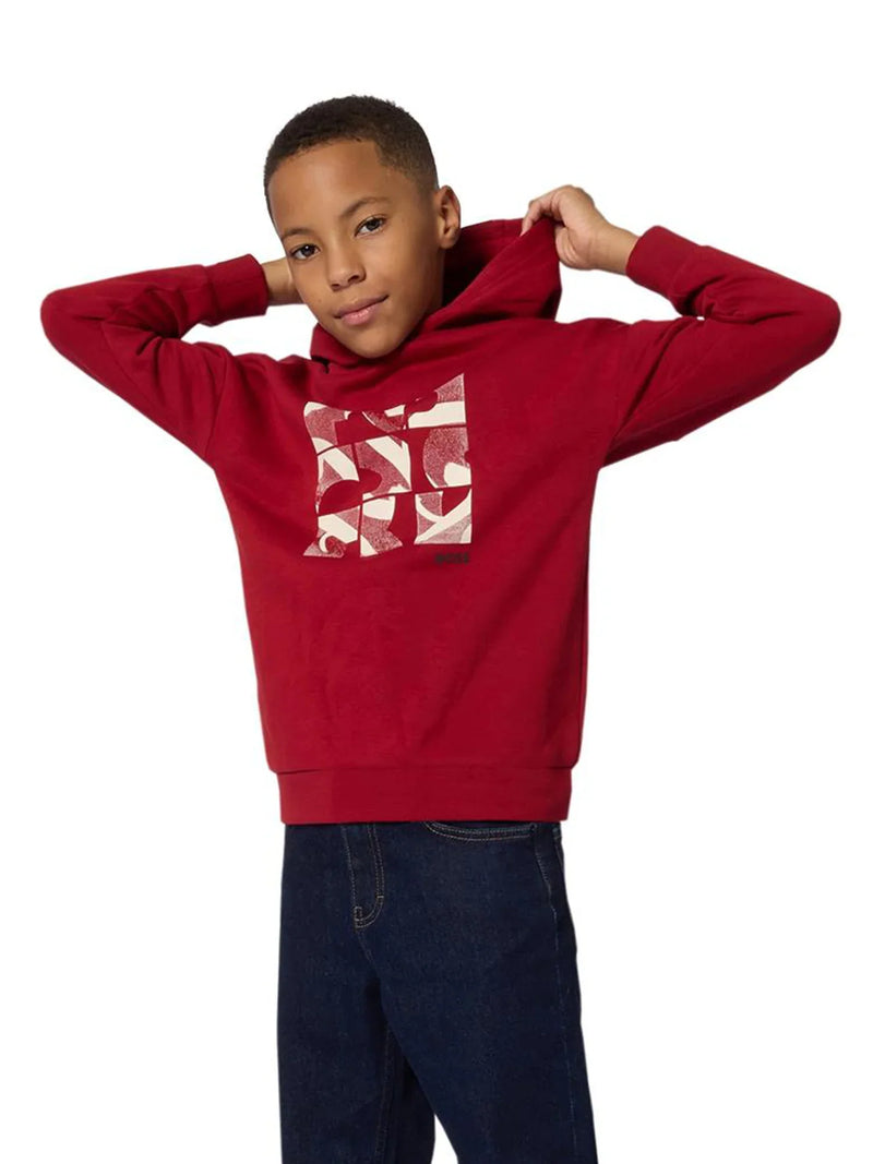 Boy wearing the BOSS logo hoodie.