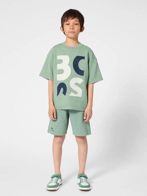 Boy modelling the BOSS logo t-shirt.