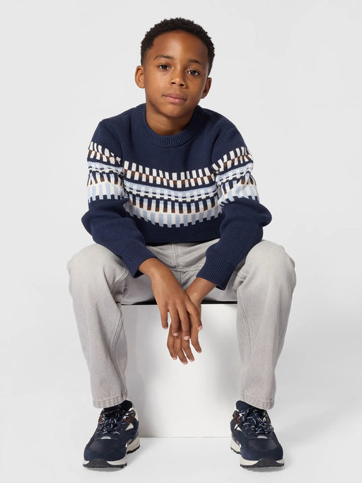 Boy modelling the BOSS patterned sweater.