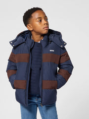 Boy modelling the BOSS puffer jacket.