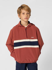 Boy modelling the BOSS half zip hoodie.