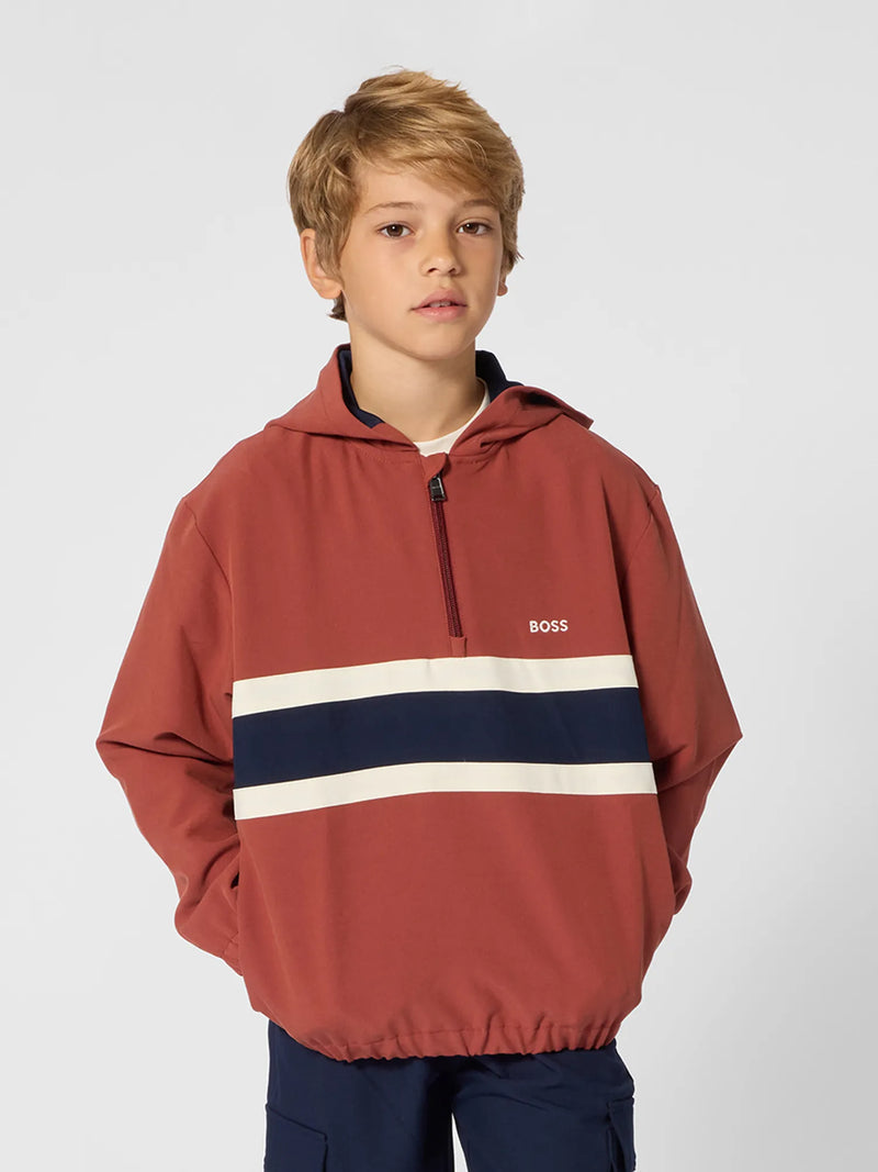 Boy modelling the BOSS half zip hoodie.