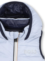 Closer look at the BOSS reversible gilet showing detail of the navy trim.