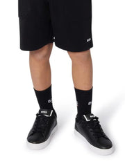 Boy wearing the BOSS socks.