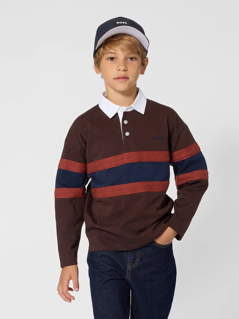 Boy wearing the BOSS striped polo shirt.