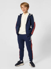 Boy wearing the BOSS track bottoms.