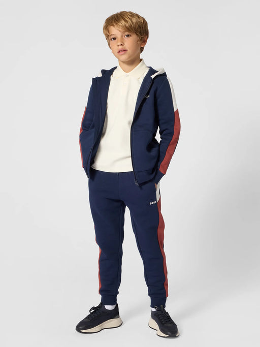 Boy modelling the BOSS tracksuit.