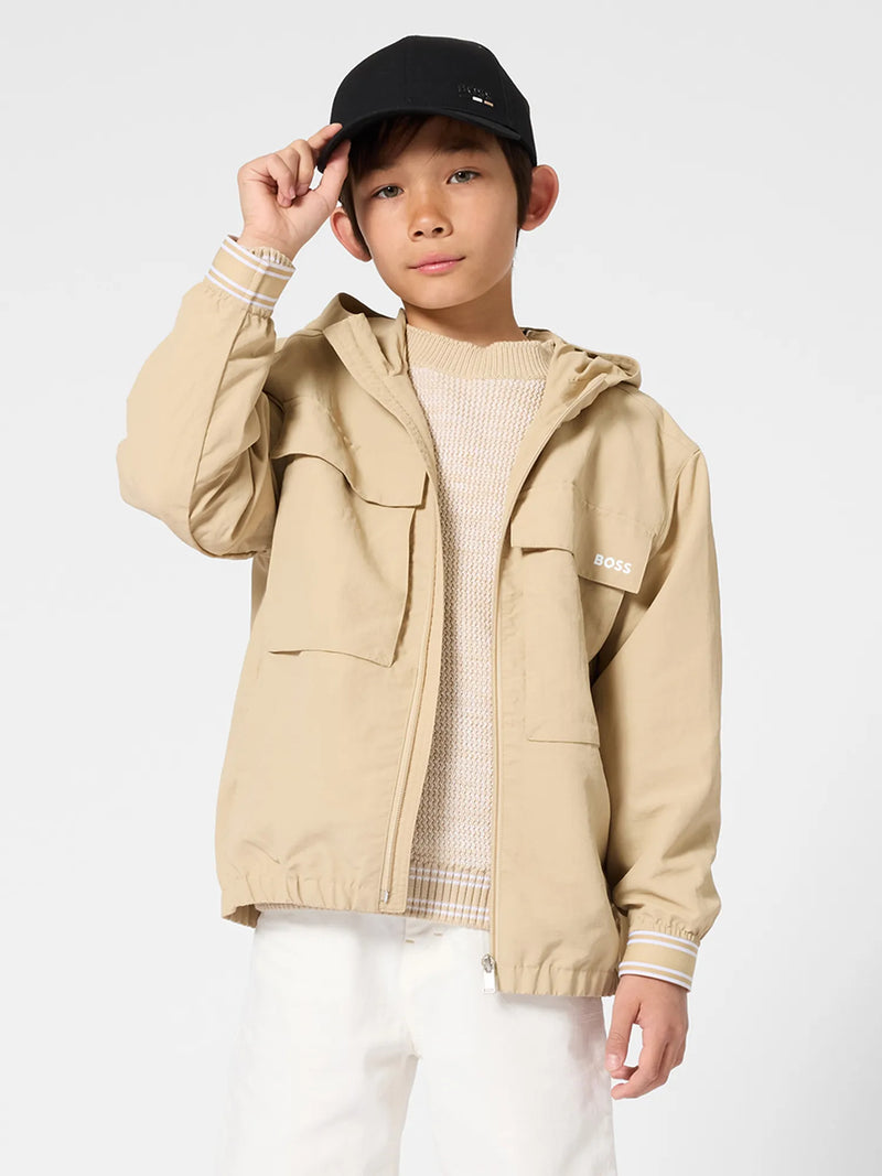 Boy modelling the BOSS windbreaker.