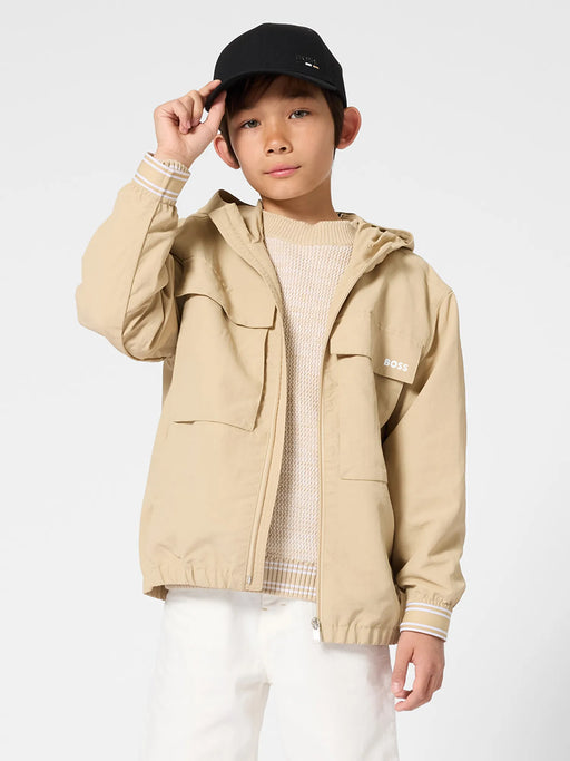 Boy modelling the BOSS windbreaker.