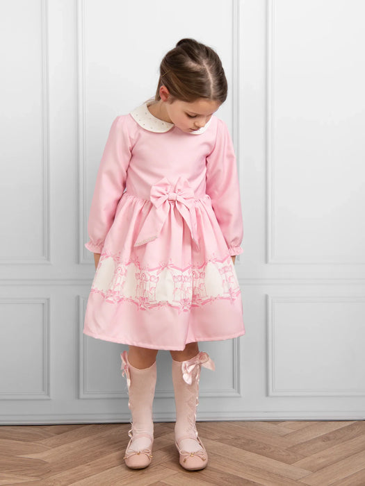 Caramelo pink dress with large bow at the waist.