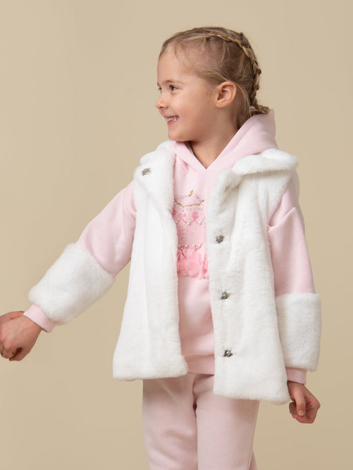 Smiling girl modelling the Caramelo Faux Fur Gilet.