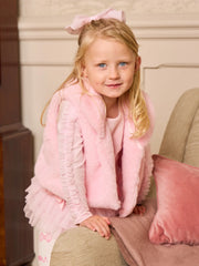 Smiling Girl modelling the Caramelo faux fur gilet.