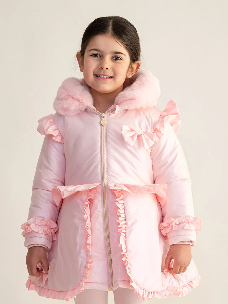 Girl wearing the Caramelo peplum coat.