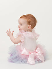 Closer look at the Caramelo rainbow tutu skirt showing detail of the pink ribbon bow on the back.