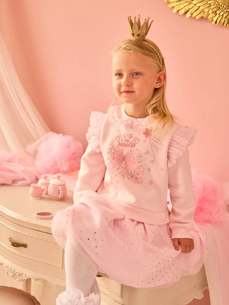 Smiling Girl modelling the Caramelo royal magic dress.