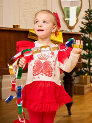 Girl wearing the Caramelo royal magic leggings set.