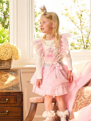 Smiling Girl modelling the Caramelo royal magic skirt set.