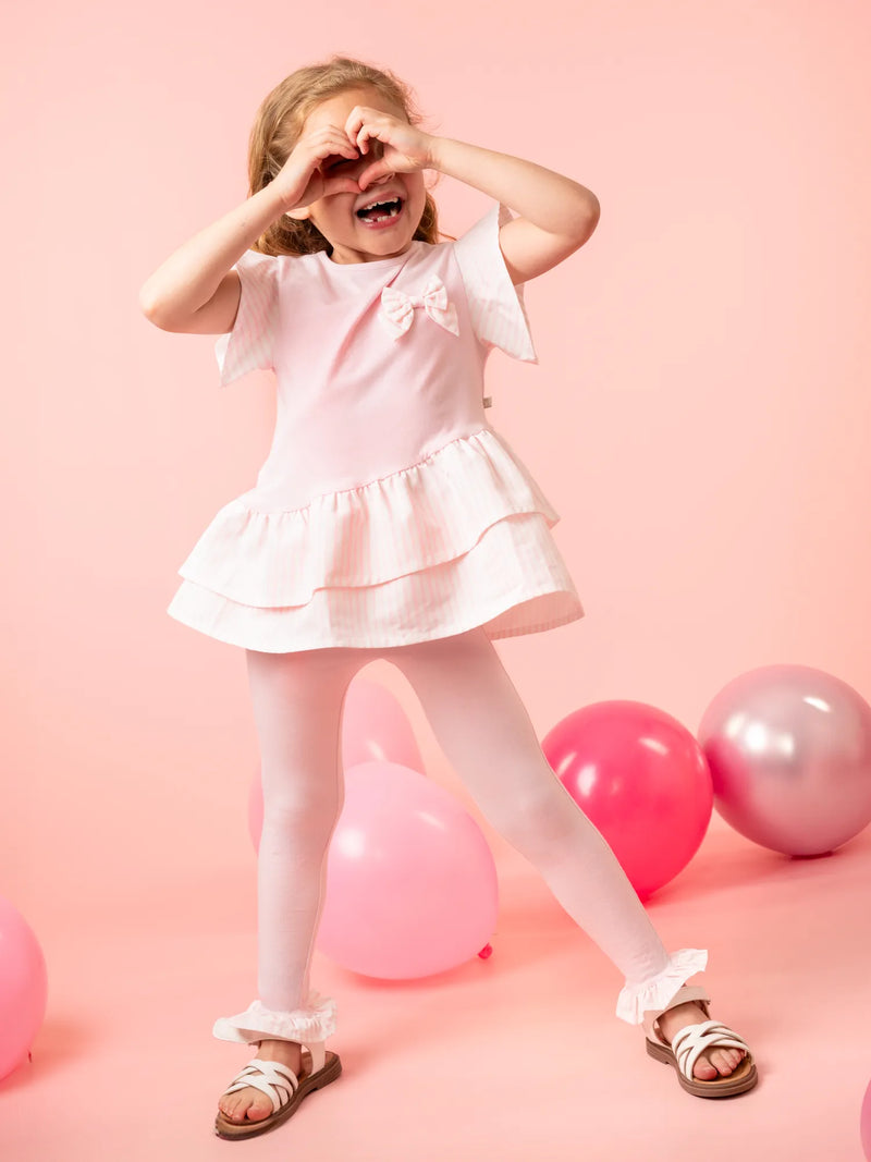 Smiling Girl modelling the Caramelo striped leggings set.