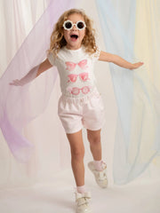 Girl wearing the Caramelo sunglasses shorts set.