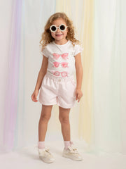 Girl modelling the Caramelo sunglasses shorts set.