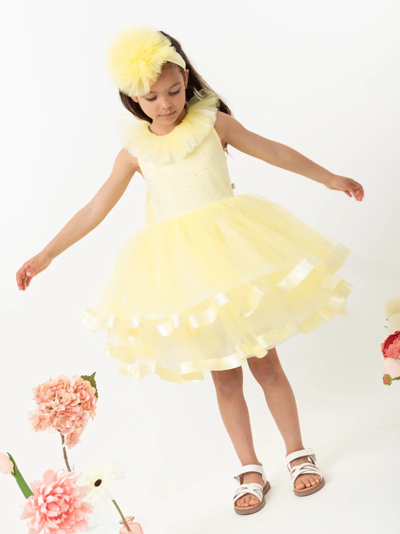Girl modelling the Caramelo tulle dress.