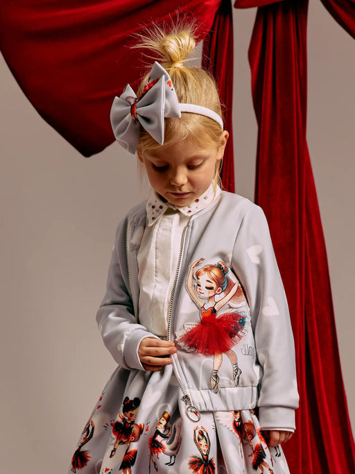 Girl wearing the Daga ballerina jacket.
