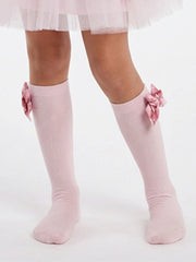 Girl wearing the Daga bow knee socks.