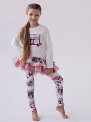 Girl in white printed leggings set by Daga.