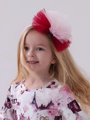 Daga red tulle bow headband, modelled by girl.