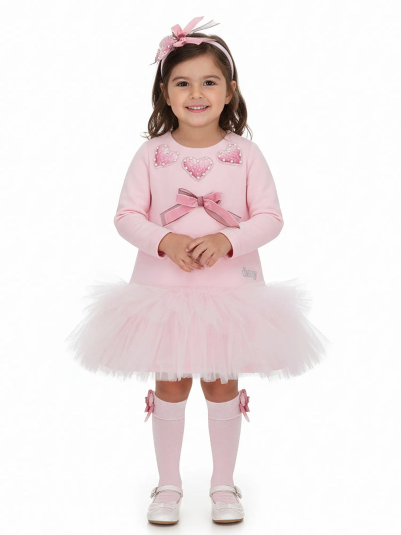 Smiling Girl modelling the Daga tulle dress.