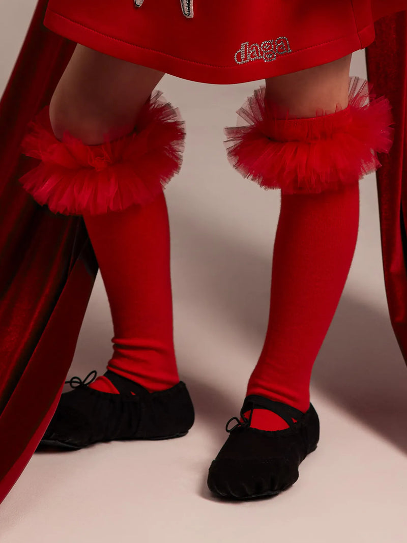 Girl modelling the Daga tulle knee socks.