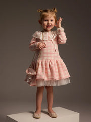 Girl wearing the Daga tweed dress.