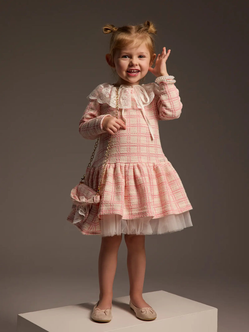 Girl wearing the Daga tweed dress.