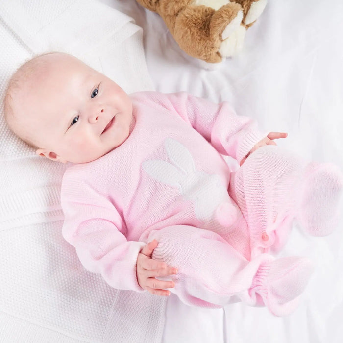 Girl wearing the Dandelion bunny babygrow.