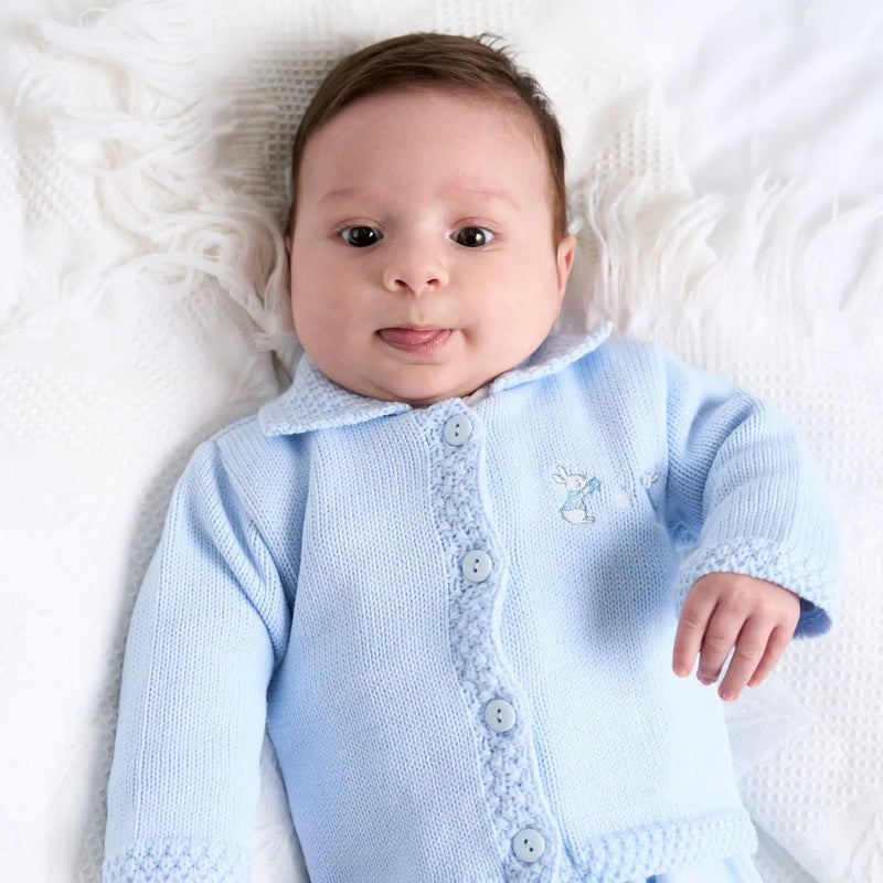 Baby boy wearing the Dandelion bunny cardigan.