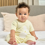 Baby boy wearing the Dandelion bunny romper.