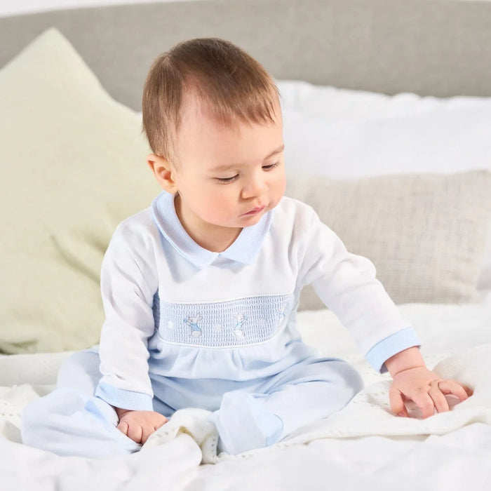 Boy wearing the Dandelion rabbit & star babygrow.