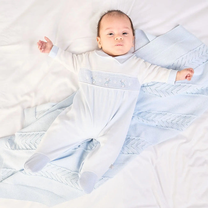 Boy wearing the Dandelion rabbit & star babygrow.