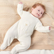 Baby wearing the Dandelion teddy bear babygrow.