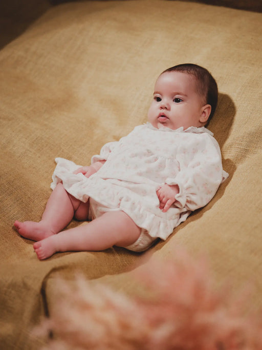 Baby girl wearing the Deolinda donna dress.