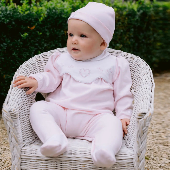 Emile et Rose pink babygrow with matching pink hat.