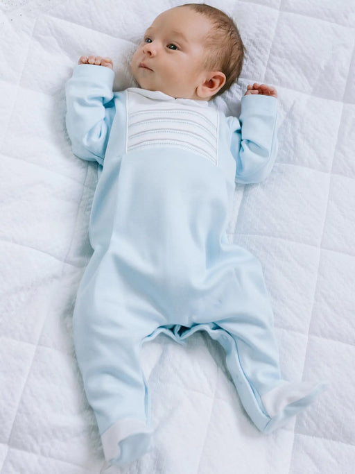 Baby boy wearing the Emile et Rose jack babygrow.