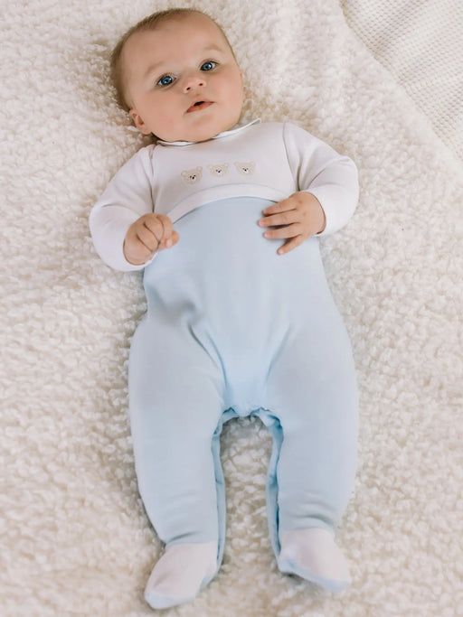 Baby boy wearing the Emile et Rose jasper babygrow.