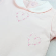 Emile et Rose jenna babygrow with pink embroidered hearts.