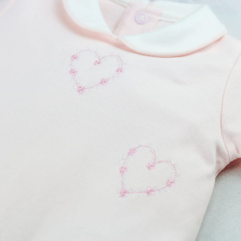 Emile et Rose jenna babygrow with pink embroidered hearts.