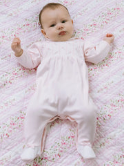 Baby girl wearing the Emile et Rose jilly babygrow.