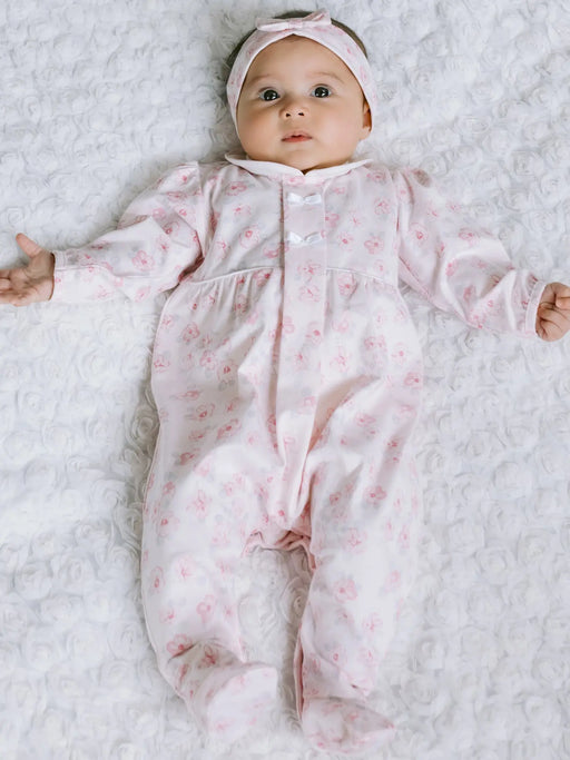 Baby girl wearing the Emile et Rose joanne babygrow.